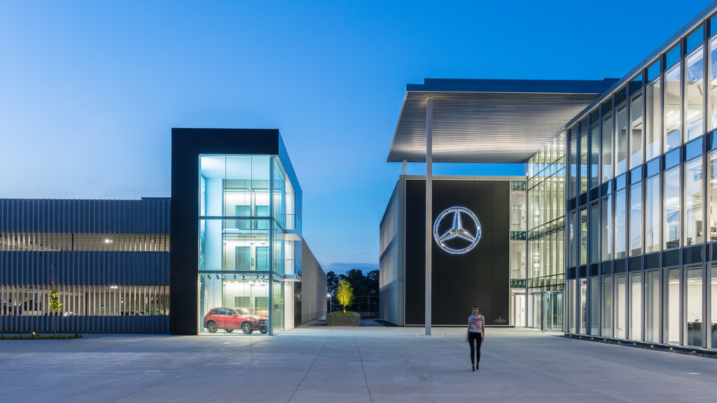 A person walking outside of a building.